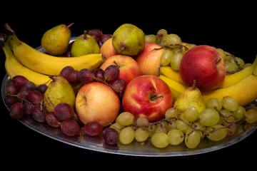 a plate full of various and colorful fruit