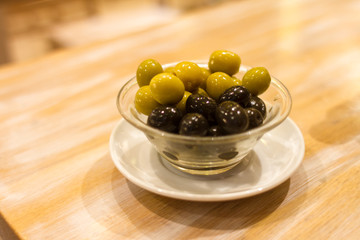 Olives in a cup on a table in Barcelona, Spain