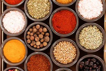 Herbs and spices on a wooden background
