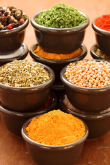 Herbs and spices on a wooden background
