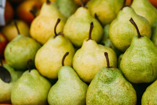 Green Ripe Pears At A Farmers Market. Heap Of Fruits
