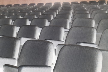 Empty rows of theater or movie seats.
