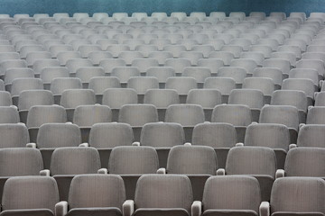 Empty rows of theater or movie seats.