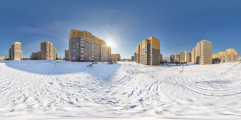 full  seamless spherical panorama 360 degrees angle view in high-rise building area urban development residential quarter in winter sunny day. 360 panorama in equirectangular projection. vr ar content