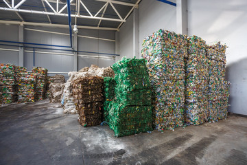Plastic pressed bales at finished products warehouse on modern waste hazardous processing plant....