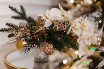 Merry Christmas and Happy New year Holidays! Decorating the Christmas tree indoors. Macro or close picture of xmas tree and gifts under it. Gift box background for 2019 new year gift card