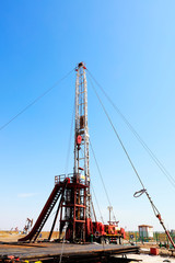 Oil drilling derrick and metal pipe