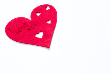 scattered red hearts on a white background. Excellent background to the day of Saint Valentine.copy space