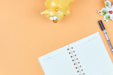 Notepad for text on a pastel color table with a copy. The concept of education and office.