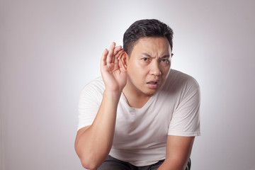 Man Listening Carefully, Hand on Ear