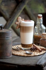 latte macchiato coffee served with caramel and cinnamon