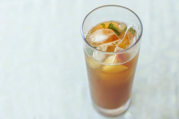 Glass of drink with fruits, ice and pimm's