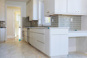 Installing new induction hob in modern kitchen