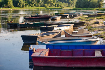Naklejka premium Novi Sad, Serbia - August 04, 2018: Danube island (Šodroš) near Novi Sad, Serbia. Parked fishing boats on the coast.
