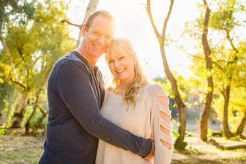 Fototapeta premium Happy Middle Aged Caucasian Couple Portrait Outdoors