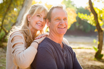 Naklejka premium Happy Middle Aged Caucasian Couple Portrait Outdoors