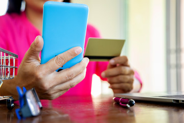 Businesswomen holding cedit card on mobile for shopping online.concept