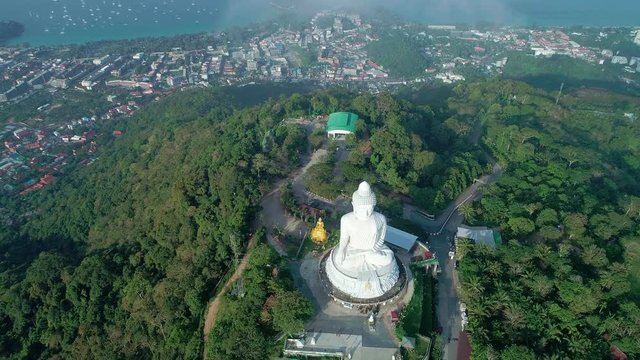 Aerial View drone shot of Big Buddha Statue on the high mountain at Phuket thailand