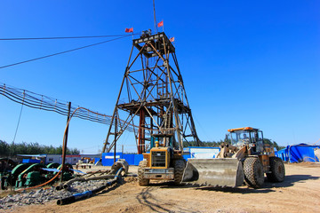 Drilling derrick and heavy duty truck in MaCheng iron mine, China