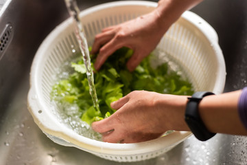 woman washing vegetables