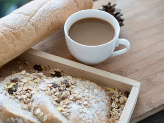 Breakfast served with glass of coffee and bread on the wood table. Health breakfast