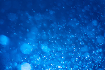 Abstract blue bokeh background.