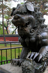 Fototapeta na wymiar Bronze lion sculpture in chengde mountain resort, China