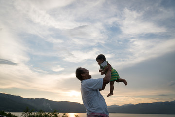 Obraz premium Dad play with his baby