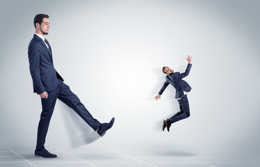 Young businessman fired cruel and aggressive by his boss with white background
