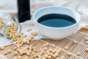 Obraz na płótnie Canvas A bowl of soy sauce and sprinkled soybeans