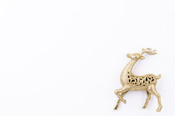 Christmas background concept. Top view of golden reindeer on white background.