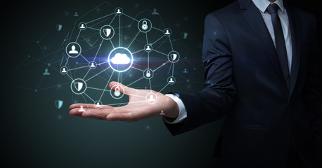 Businessman holding networking connection concept with dark wallpaper