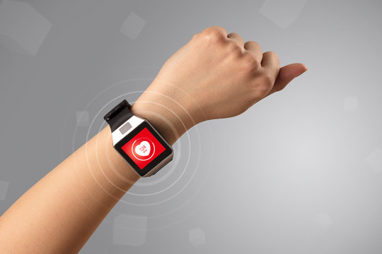 Naked Female Hand With Smartwatch And With Heart Rate Icon On The Watch