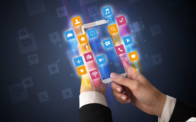 Female hand using smartphone with colorful angular fast switching application icons around