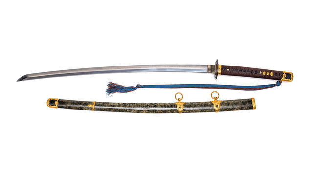 'Kai Gunto' : Japanese Marine Sword From World War 2 with scabbard wrapped by ray skin isolated in white background.