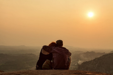 HAMPI, KARNATAKA, INDIA - JANUARY 15 2017: A couple is watching 