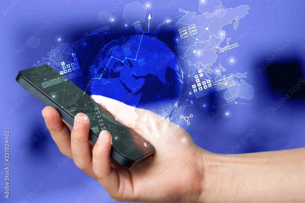 Aufkleber hand using phone with global reports and stock market change concept