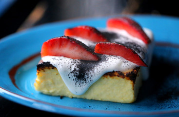 Macro photo of delicious fresh casserole with strawberrie