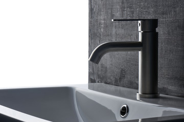 Plumbing. The interior of the bathroom. Faucet sink on black and white background.