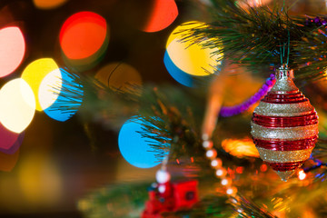 Beautiful original toy whirligig on Christmas tree close-up