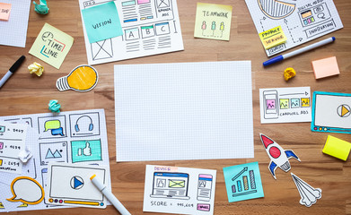 Business digital marketing with paperwork sketch on wood table.analysis strategy concepts