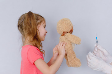 Injection. Vaccinations. Children's fear of vaccinations. The girl is afraid to be vaccinated....