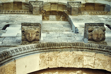 Stone heads on the ancient wall, Diocletian's Palace. Split, Croatia.