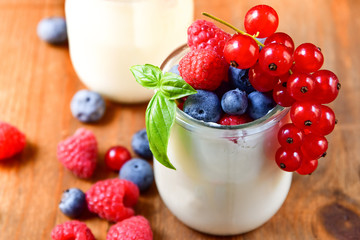  yogurt with raspberries, blackberries, currants, mint leaves. the concept of diet food and vitamins, Breakfast at the hotel. selective focus