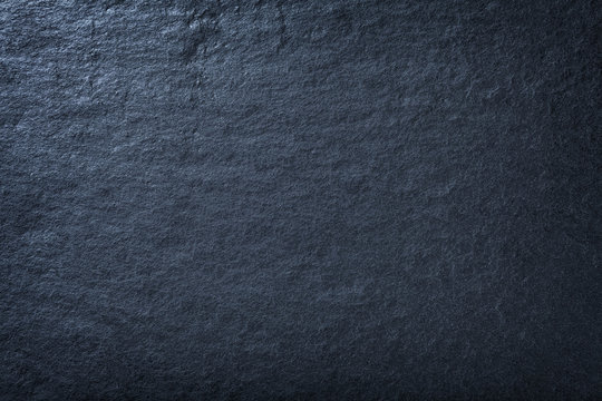 Dark blue background of natural slate. Texture of stone