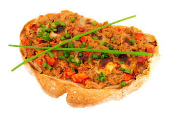 Grilled tuna fish and cheese on toast with chives isolated on a white background