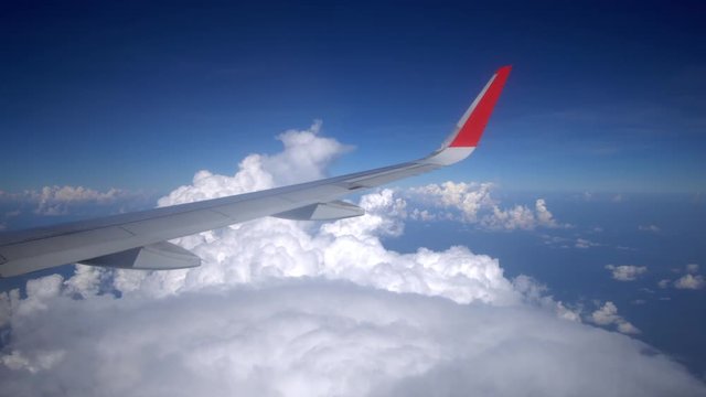 Airplane flying on cloud, View through an airplane window