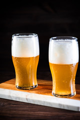 a glass of beer  on wooden background
