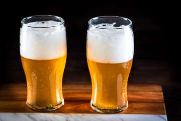 a glass of beer  on wooden background