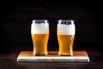 a glass of beer  on wooden background